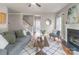 Spacious living room with a fireplace, hardwood floors, and an open layout leading to the staircase at 2619 Merion Hills Ct, Charlotte, NC 28269