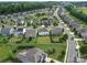 A residential community with manicured lawns, mature trees, and tree lined streets at 3009 Palm Dr, Fort Mill, SC 29715