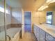 Bright bathroom featuring a double sink vanity and a separate tub and walk-in shower at 3009 Palm Dr, Fort Mill, SC 29715