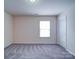 Neutral bedroom with carpeted floors and a window with white blinds providing natural light at 3009 Palm Dr, Fort Mill, SC 29715