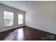 Cozy bedroom with two windows offering ample natural light and hardwood floors at 3009 Palm Dr, Fort Mill, SC 29715