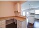 Built-in home office space with granite countertops and custom cabinetry located off the kitchen at 3009 Palm Dr, Fort Mill, SC 29715