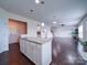 Kitchen island features granite countertops and connects to an open concept floor plan at 3009 Palm Dr, Fort Mill, SC 29715