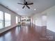 Bright and airy living room featuring hardwood floors and seamless flow to the kitchen at 3009 Palm Dr, Fort Mill, SC 29715