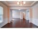 Large living room space with hardwood floors, crown molding, and natural light at 3009 Palm Dr, Fort Mill, SC 29715