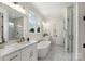 Bright bathroom featuring a luxurious tub, marble accents, and double vanity at 3222 Player Ct, Salisbury, NC 28144
