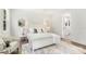 Cozy bedroom featuring a plush rug, neutral tones, decorative mirrors, and bright natural light at 3222 Player Ct, Salisbury, NC 28144