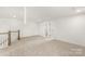 Large bonus room with neutral carpet and ample natural light, perfect for flexible living at 3222 Player Ct, Salisbury, NC 28144
