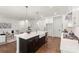 Beautiful kitchen island with a farmhouse sink, stainless steel dishwasher, and breakfast bar seating at 3222 Player Ct, Salisbury, NC 28144