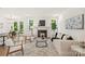 Inviting living room with a fireplace, neutral decor, and large windows providing ample natural light at 3222 Player Ct, Salisbury, NC 28144
