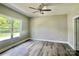 This bright bedroom offers natural light, hardwood floors, and a neutral color palette, ready for personal touches at 325 Jordan Ave, Salisbury, NC 28159