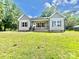 Charming single-story home with gray siding, wooden shutters, and a well-maintained front yard at 325 Jordan Ave, Salisbury, NC 28159