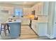 Beautiful kitchen featuring white cabinets, a stylish island, stainless appliances, and modern countertops and backsplash at 325 Jordan Ave, Salisbury, NC 28159