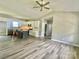 Open-concept layout with spacious living area flowing into the modern kitchen, vaulted ceiling, and hardwood floors at 325 Jordan Ave, Salisbury, NC 28159