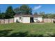 View of the fenced backyard, showing the patio and well-maintained lawn at 327 Downing St, Troutman, NC 28166