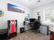 Bedroom showcases a city-themed mural and displays a unique vending machine, offering a modern industrial-style living space at 327 Downing St, Troutman, NC 28166