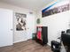Bedroom showcases a city-themed mural, wall decor, and displays a unique vending machine, offering a modern living space at 327 Downing St, Troutman, NC 28166