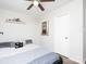 Comfortable bedroom with ceiling fan, decorative shelves, and a gray platform bed, offering a relaxing space at 327 Downing St, Troutman, NC 28166