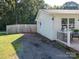 Exterior view of the home showing the driveway and a portion of the deck at 327 Downing St, Troutman, NC 28166