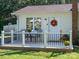Charming covered porch with a table and chairs, perfect for enjoying the outdoors at 327 Downing St, Troutman, NC 28166