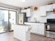 Modern kitchen with white cabinets, granite countertops, and a stainless steel appliance at 327 Downing St, Troutman, NC 28166