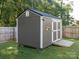Exterior view of backyard shed with a ramp entrance and gray siding at 327 Downing St, Troutman, NC 28166