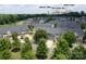 Scenic aerial view of the neighborhood showcasing mature trees and well-maintained homes near Charlotte's skyline at 3537 Hornets Nest Way # 206, Charlotte, NC 28208