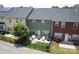 Aerial view of a backyard with a lush lawn and patio, perfect for relaxing and entertaining in style at 3537 Hornets Nest Way # 206, Charlotte, NC 28208