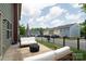 A serene backyard setting with comfortable seating and a modern fire pit, ideal for relaxation and social gatherings at 3537 Hornets Nest Way # 206, Charlotte, NC 28208