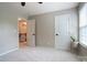 Bedroom with doors that lead to the upstairs hallway and a large window at 3537 Hornets Nest Way # 206, Charlotte, NC 28208