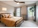 Bedroom featuring a full-sized bed, two windows with curtains, and a plant at 3537 Hornets Nest Way # 206, Charlotte, NC 28208
