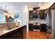 Well-equipped kitchen with stainless steel appliances, dark cabinetry, and a granite-topped island at 3537 Hornets Nest Way # 206, Charlotte, NC 28208