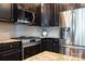 Close-up of the kitchen, showcasing stainless steel appliances and granite countertops at 3537 Hornets Nest Way # 206, Charlotte, NC 28208