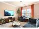 Spacious living room featuring large windows and ample seating at 3537 Hornets Nest Way # 206, Charlotte, NC 28208