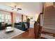 Cozy living room featuring hardwood floors, a ceiling fan, and staircase at 3537 Hornets Nest Way # 206, Charlotte, NC 28208
