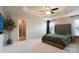 Spacious primary bedroom features a trey ceiling, ensuite bathroom, and a comfortable bed at 3537 Hornets Nest Way # 206, Charlotte, NC 28208