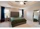 Well-lit main bedroom features a large bed, neutral tones, and a ceiling fan at 3537 Hornets Nest Way # 206, Charlotte, NC 28208