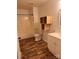Bathroom featuring a tub and shower combo, modern vanity and wood-style vinyl flooring at 379 Sharpe St, Mooresville, NC 28115