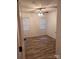 Bright bedroom featuring wood-look flooring, ceiling fan and natural light from two windows at 379 Sharpe St, Mooresville, NC 28115