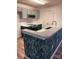 This kitchen offers modern appliances, white subway tile and a patterned kitchen peninsula at 379 Sharpe St, Mooresville, NC 28115