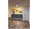 An open-concept living room and kitchen offers updated cabinets and a view of the doorway at 379 Sharpe St, Mooresville, NC 28115