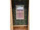A window with tropical wallpaper provides natural light and a unique design element at 379 Sharpe St, Mooresville, NC 28115