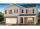 Charming two-story home with a brick and siding exterior, a two-car garage, and well-manicured landscaping at 401 Brinkley Dr, Kings Mountain, NC 28086