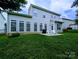 The back of the home features a patio and a lush green lawn at 408 Presidio Dr, Rock Hill, SC 29732