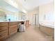 Bright primary bathroom featuring double vanity, soaking tub, and natural light at 408 Presidio Dr, Rock Hill, SC 29732