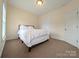 Neutral bedroom with ample natural light, featuring a cozy bed and closet at 408 Presidio Dr, Rock Hill, SC 29732
