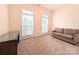Bedroom with carpet, two windows and a loveseat provides a cozy and inviting space at 408 Presidio Dr, Rock Hill, SC 29732