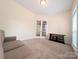 Bedroom with french doors, carpet and a loveseat provides a cozy and inviting space at 408 Presidio Dr, Rock Hill, SC 29732