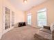 Bedroom with french doors, carpet and a loveseat provides a cozy and inviting space at 408 Presidio Dr, Rock Hill, SC 29732