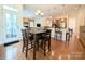 Open dining area adjacent to kitchen with wood floors and backyard access at 408 Presidio Dr, Rock Hill, SC 29732